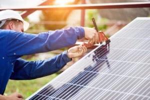 Installation of stand-alone exterior photo voltaic panels system. Renewable green energy generation.