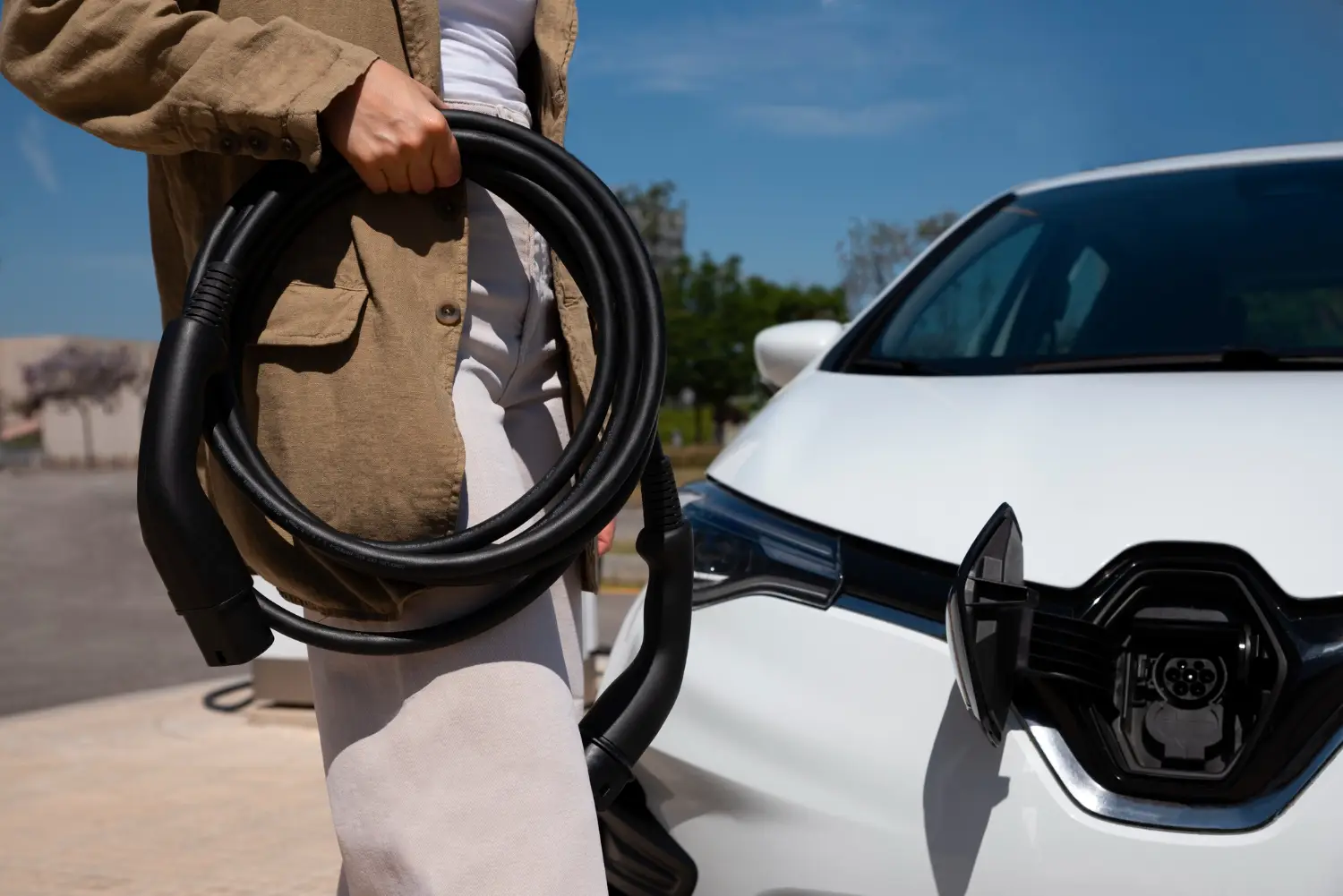 A man charging a car